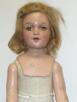An older doll that has been brought in to the Doll Hospital to be restored